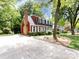 Charming two-story home with mature landscaping and a long driveway at 6007 Patrick Pl, Charlotte, NC 28210