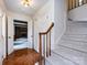 Inviting foyer features hardwood floors, a staircase, and access to living spaces at 6007 Patrick Pl, Charlotte, NC 28210