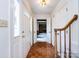 Inviting foyer featuring hardwood floors, access to living spaces, and natural light at 6007 Patrick Pl, Charlotte, NC 28210