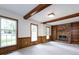 Bright living room with a brick fireplace and large windows offering outdoor views at 6007 Patrick Pl, Charlotte, NC 28210