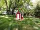 A charming red shed in the backyard offers extra storage or a potential hobby space at 6007 Patrick Pl, Charlotte, NC 28210