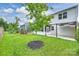 Spacious backyard featuring lush greenery, a patio with pergola, and ample space for outdoor enjoyment at 7209 Brookline Pl, Huntersville, NC 28078