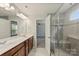 Bathroom with double vanity and glass shower enclosure at 7209 Brookline Pl, Huntersville, NC 28078