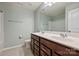 Bathroom featuring a double vanity with a mirror, toilet, and shower/tub combination at 7209 Brookline Pl, Huntersville, NC 28078