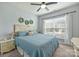 Cozy bedroom with a comfy bed, natural light, and bright curtains at 7209 Brookline Pl, Huntersville, NC 28078