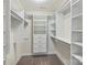 Walk-in closet featuring built-in shelving and drawers at 7209 Brookline Pl, Huntersville, NC 28078