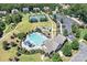 Aerial view of neighborhood amenities, including a pool, tennis courts, playground, and walking trails at 7209 Brookline Pl, Huntersville, NC 28078