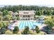 Community pool with abundant lounge seating, umbrellas, a water slide and a clubhouse at 7209 Brookline Pl, Huntersville, NC 28078