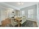 Elegant dining room with a wooden table, stylish chairs, and bright natural lighting at 7209 Brookline Pl, Huntersville, NC 28078