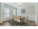 Formal dining room with modern light fixture, neutral walls, and elegant decor at 7209 Brookline Pl, Huntersville, NC 28078