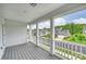 View from the porch of a charming home with a landscaped front yard and a neighborhood street at 7209 Brookline Pl, Huntersville, NC 28078