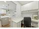 Convenient home office with built-in desk, drawers and cabinets just off the kitchen at 7209 Brookline Pl, Huntersville, NC 28078