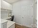 Well-lit office features built-in desk and cabinets at 7209 Brookline Pl, Huntersville, NC 28078