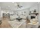 Open-concept living area with fireplace, hardwood floors, and lots of natural light at 7209 Brookline Pl, Huntersville, NC 28078
