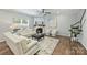 Cozy living room with a fireplace, hardwood floors, and ample seating at 7209 Brookline Pl, Huntersville, NC 28078