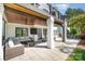 Outdoor patio offering multiple lounge spaces and an outdoor TV at 7280 Woodside Ct, Denver, NC 28037