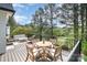 Outdoor patio with comfortable seating and a dining area overlooking the green backyard at 7280 Woodside Ct, Denver, NC 28037