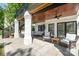 Back porch features multiple seating areas and ceiling fans at 7280 Woodside Ct, Denver, NC 28037