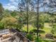 Inviting deck area with comfortable seating overlooking the meticulously maintained backyard and scenic golf course views at 7280 Woodside Ct, Denver, NC 28037