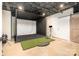 A golf simulator is set up in this finished basement at 7280 Woodside Ct, Denver, NC 28037
