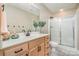 Classic bathroom featuring a glass enclosed shower, warm lighting, and updated fixtures at 7280 Woodside Ct, Denver, NC 28037