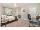 Bedroom featuring neutral decor, a study space, and carpet flooring at 7280 Woodside Ct, Denver, NC 28037
