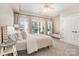 This bedroom has large windows that provide natural light and neutral decor at 7280 Woodside Ct, Denver, NC 28037