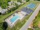 Aerial view of the community pool, tennis courts, and playground offering a variety of recreational amenities at 7280 Woodside Ct, Denver, NC 28037