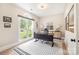 Home office with large window offering backyard views, modern desk, and stylish decor at 7280 Woodside Ct, Denver, NC 28037