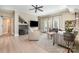 Spacious living room with hardwood floors, ceiling fan, a large TV and a barn door at 7280 Woodside Ct, Denver, NC 28037