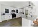Modern kitchen with white cabinetry, stainless steel appliances, granite countertops, and updated fixtures at 751 N Miller Ave, Statesville, NC 28677