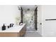 Contemporary bathroom featuring a spacious glass shower with marble tile and double vanity at 816 Tennyson Dr, Charlotte, NC 28208