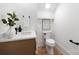 Half-bath featuring white vanity, round sink, and modern fixtures at 816 Tennyson Dr, Charlotte, NC 28208