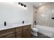 Bright bathroom with double sink vanity, sleek faucets, and ceramic tub surround at 816 Tennyson Dr, Charlotte, NC 28208