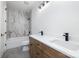 Beautiful bathroom with marble tiled wall, double vanity, and modern black fixtures at 816 Tennyson Dr, Charlotte, NC 28208