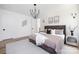 Warm, naturally lit bedroom with cozy decor, a soft rug, and modern light fixtures at 816 Tennyson Dr, Charlotte, NC 28208