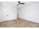 This bright bedroom has beautiful floors, white walls, and black door hardware at 816 Tennyson Dr, Charlotte, NC 28208