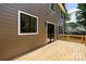 Spacious wooden deck with sliding glass doors offering outdoor relaxation and entertainment space at 816 Tennyson Dr, Charlotte, NC 28208