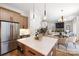 Open-concept kitchen featuring stainless steel appliances, a center island, and views to the dining and living areas at 816 Tennyson Dr, Charlotte, NC 28208