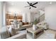 Open-concept living room flowing into the kitchen and dining area, featuring hardwood floors and modern decor at 816 Tennyson Dr, Charlotte, NC 28208