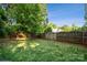 Private backyard with a well-maintained lawn and sturdy wooden fence, ideal for outdoor activities at 817 Quince Ct, Indian Trail, NC 28079