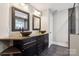 Stylish bathroom with double sinks, dark cabinetry, granite countertops, and modern fixtures at 817 Quince Ct, Indian Trail, NC 28079