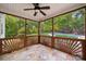 Covered patio with tile flooring and screens, featuring a view of the backyard and pool at 817 Quince Ct, Indian Trail, NC 28079