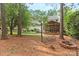 Backyard with fire pit, seating and well-maintained landscaping surrounding the property at 9101 Strattonville Ct, Huntersville, NC 28078