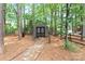 A backyard with a shed and well-maintained landscaping surrounding the property at 9101 Strattonville Ct, Huntersville, NC 28078