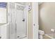 Bathroom featuring glass-door shower with updated fixtures, toilet, and neutral paint at 9101 Strattonville Ct, Huntersville, NC 28078