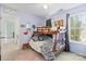 Charming bedroom with bunk beds, large windows, and playful decorations for a comfortable space at 9101 Strattonville Ct, Huntersville, NC 28078