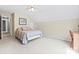 Bright, airy bedroom featuring carpeted floors, ceiling fan, and door to hallway at 9101 Strattonville Ct, Huntersville, NC 28078
