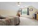 Neutral bedroom featuring carpeted floors, ceiling fan, and window for lots of natural light at 9101 Strattonville Ct, Huntersville, NC 28078