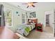 Comfortable bedroom with a green painted wall and big windows offering natural light at 9101 Strattonville Ct, Huntersville, NC 28078